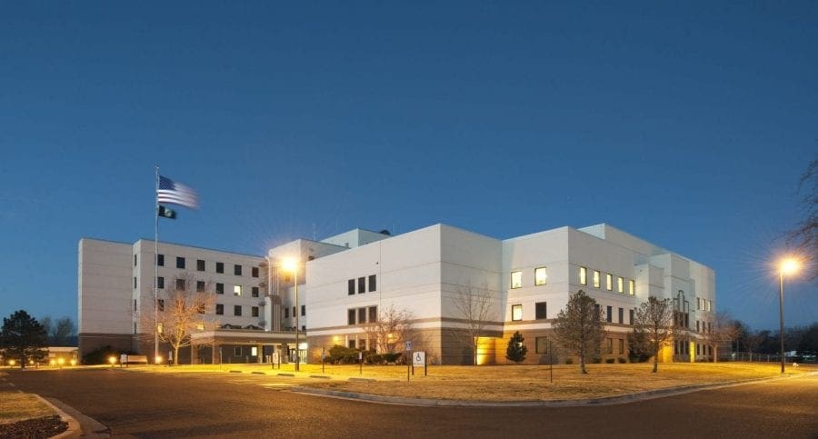 Large white building with grass