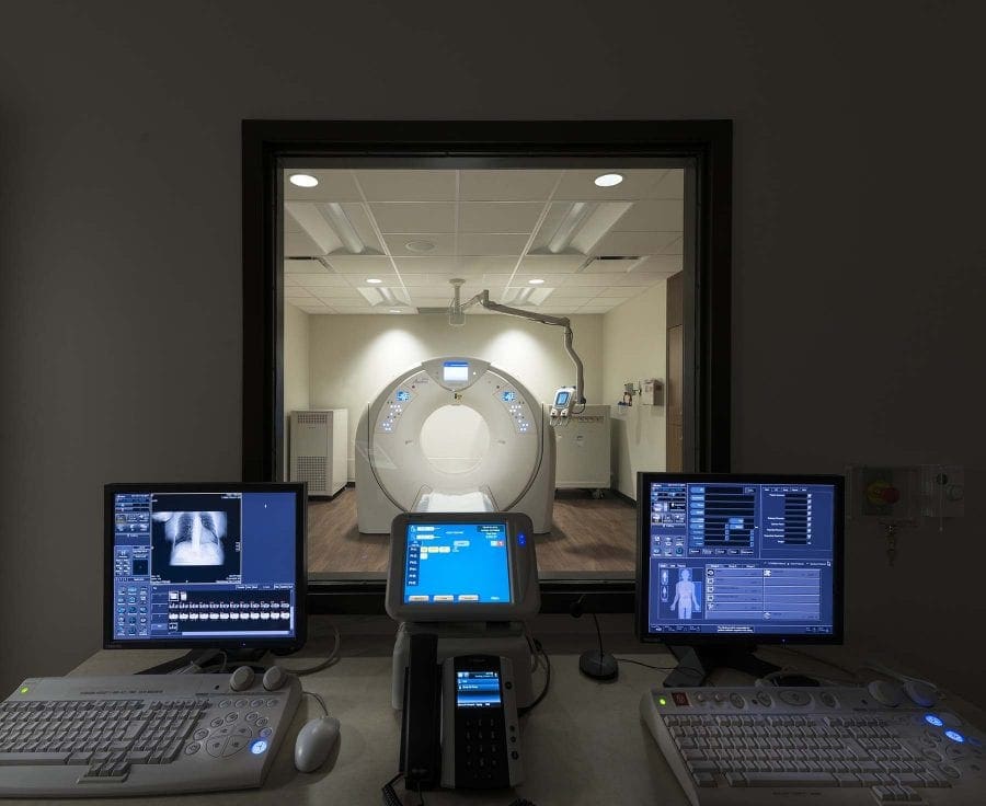 Photo with screens and big machine