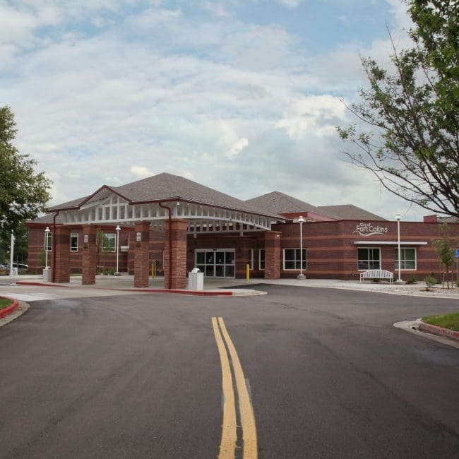 Large brick building with grey roof