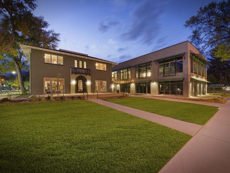 Building at night with green grass