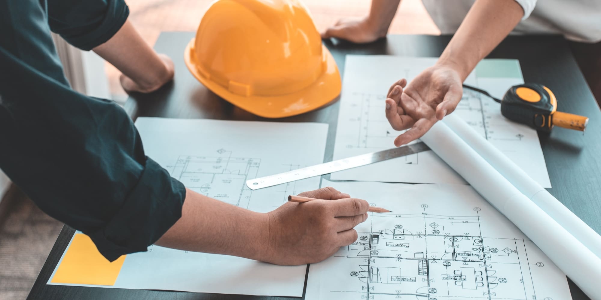 engineer team working on blueprints