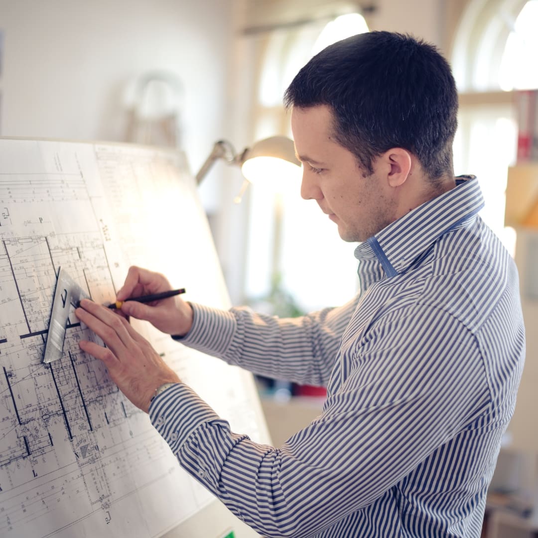 architect working on blueprint