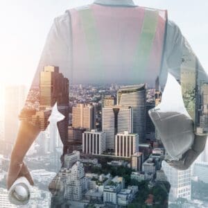overlay of construction worker and a cityscape