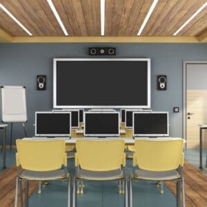 classroom with computers and screen