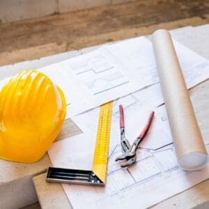 Construction materials on a blueprint.