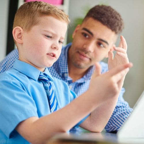 A young student getting personalized attention in class