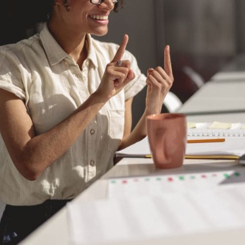 A teacher signing in class